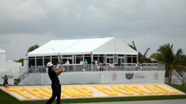 DORAL, FL - MARCH 08:  Dustin Johnson of the United States plays his shot on the eighteenth hole during the final round of the World Golf Championships-Cad