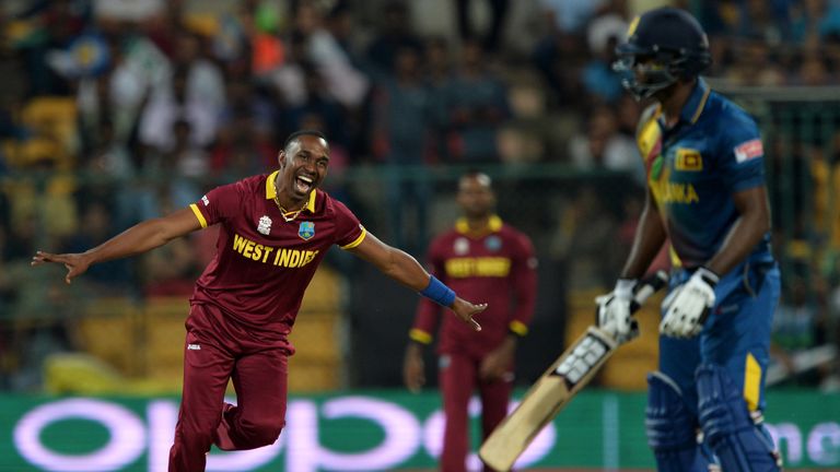 West Indies bowler Dwayne Bravo (L) celebrates the wicket of Sri Lankan batsman Angelo Mathews (R) during the W