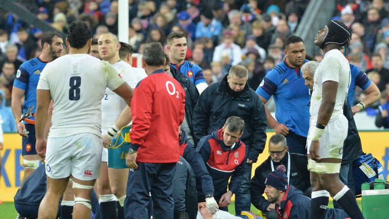 Dylan Hartley receives medical attention during England's Six Nations match against France.
