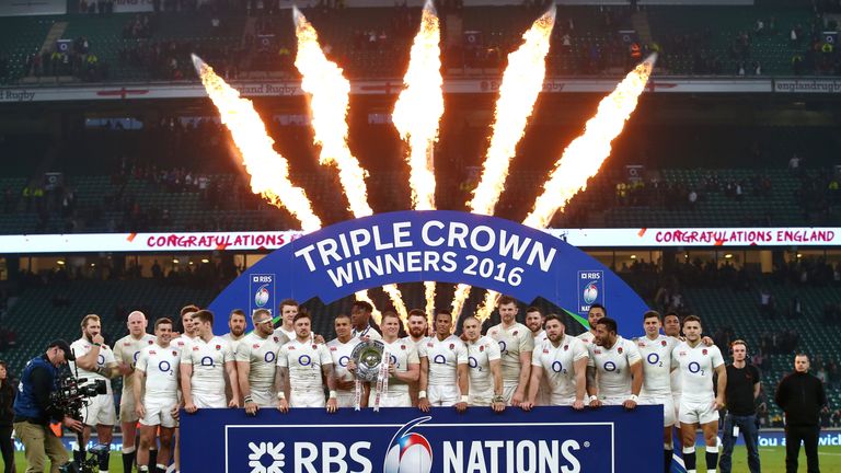 Dylan Hartley of England celebrates with team mates and the Triple Crown trophy after the RBS Six Nations match v Wales at Twickenham