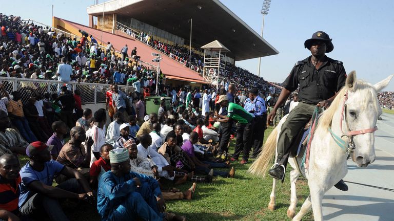 A policeman rides a horse as he patrols during the African Cup of Nations qualification match between Egypt and Nigeria