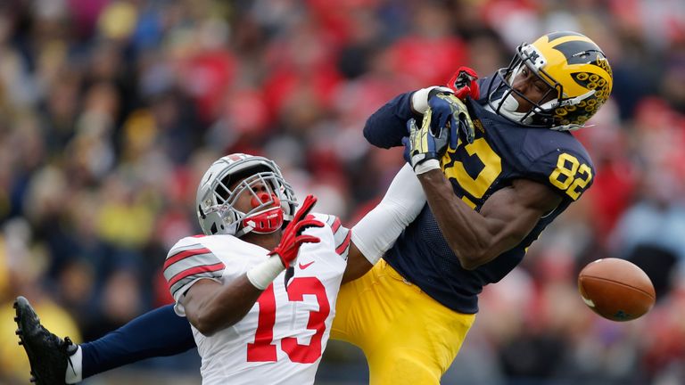 Eli Apple #13 of the Ohio State Buckeyes breaks up a pass intended for Amara Darboh #82 of the Michigan Wolverines