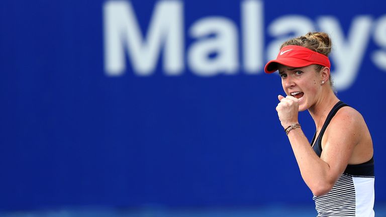 Svitolina celebrates winning a point during a tense final