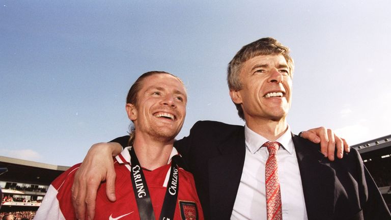 Emmanuel Petit and Arsene Wenger celebrate winning the Premier League title in May 1998