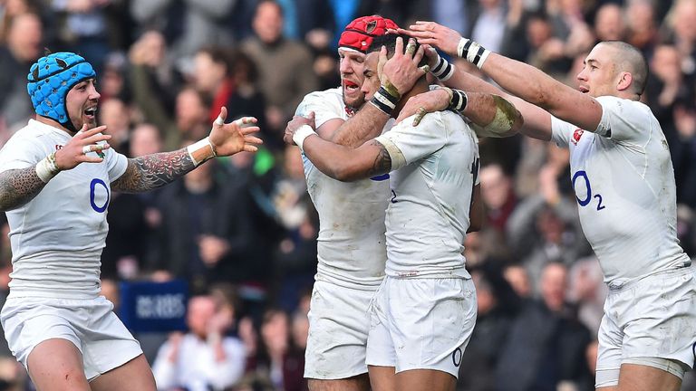 England's wing Anthony Watson (2R) is congratulated by England's wing Jack Nowell (L), England's flanker James Haskell (2L) and England's wing Mike Brown