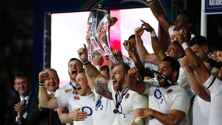 England's players celebrate with the trophy winning the Six Nations 