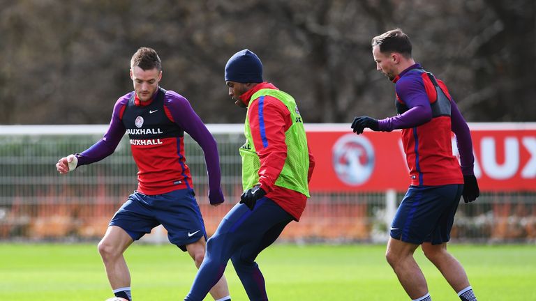 Jamie Vardy (L) of England challenges Daniel Sturridge with Danny Drinkwater (R) during a training session prior to the Inter