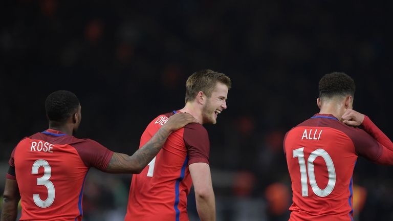 Eric Dier (c) celebrates with Tottenham teammates Danny Rose and Dele Alli after scoring the winner against Germany