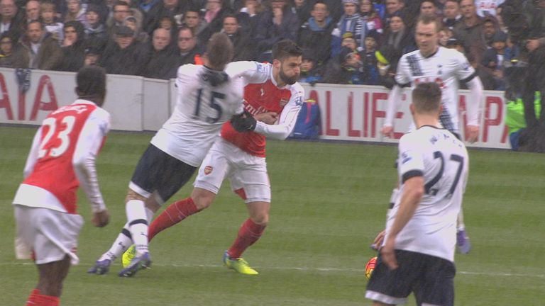 Eric Dier and Olivier Girous tussled near the halfway line