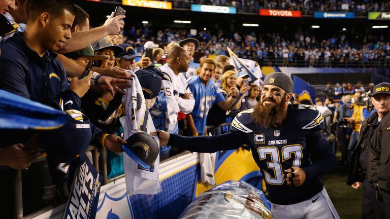 Eric Weddle #32 of the San Diego Chargers greets fans after the San Diego Chargers defeated the Miami Dolphins 30-14 at Qualco