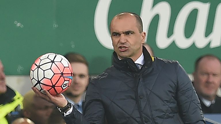Everton's Spanish manager Roberto Martinez gathers the ball during the FA cup quarter-final football match between Everton and Chelsea at Goodison Park