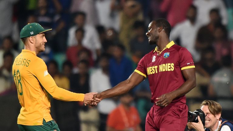 Faf du Plessis shakes hands with Sammy after the match ends
