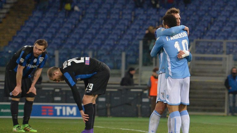 Lazio's forward from Germany Miroslav Klose (R) celebrates with his teammate Felipe Anderson after scoring during the Italian Serie As)