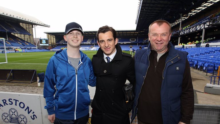 Fans pose for photographs with Everton's Leighton Baines