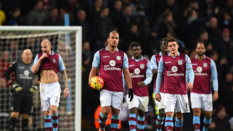 Gabby Agbonlahor and Ashley Westwood of Aston Villa show their frustration after Everton's third goal