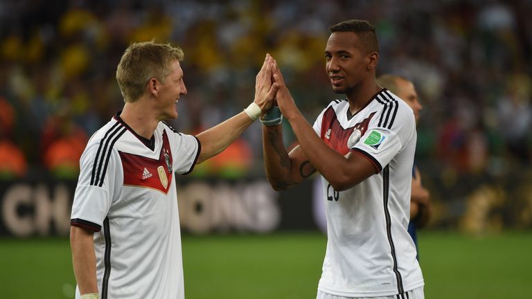 Germany's midfielder Bastian Schweinsteiger (left) and Jerome Boateng celebrate after winning the 2014 World Cup final