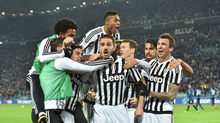 Leonardo Bonucci (centre) of Juventus celebrates winning penalty against Inter Milan