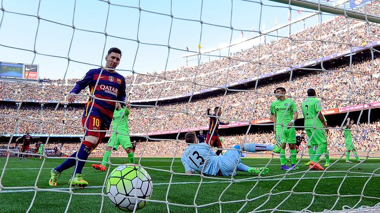 Lionel Messi collects the ball in the Getafe net