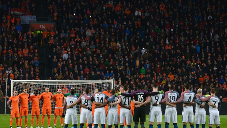Netherlands and France players observe a minute of silence