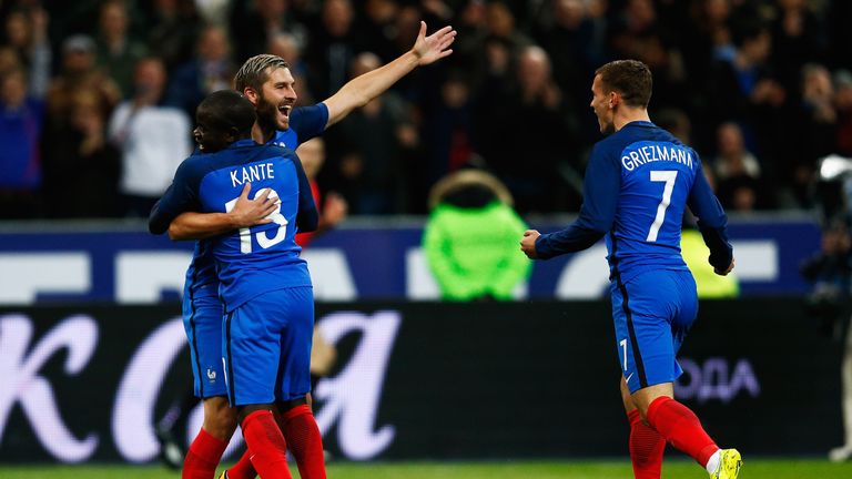 N'Golo Kante celebrates with teammates, Andre-Pierre Gignac and Antoine Griezm, after scoring France's first goal in a 4-2 win over Russia in Paris