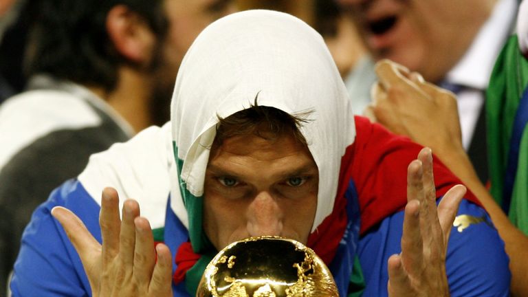 Francesco Totti of Italy celebrates with the world cup trophy following his team's victory during the FIFA World Cup Germany 2006 Final 