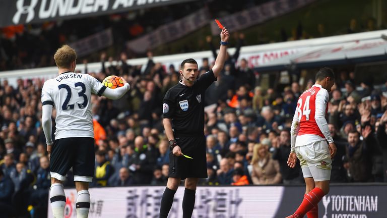 Francis Coquelin of Arsenal is shown a red card by referee Michael Oliver 