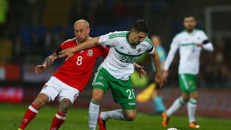 Craig Cathcart of Northern Ireland holds off  David Cotterill of Wales during the international friendly