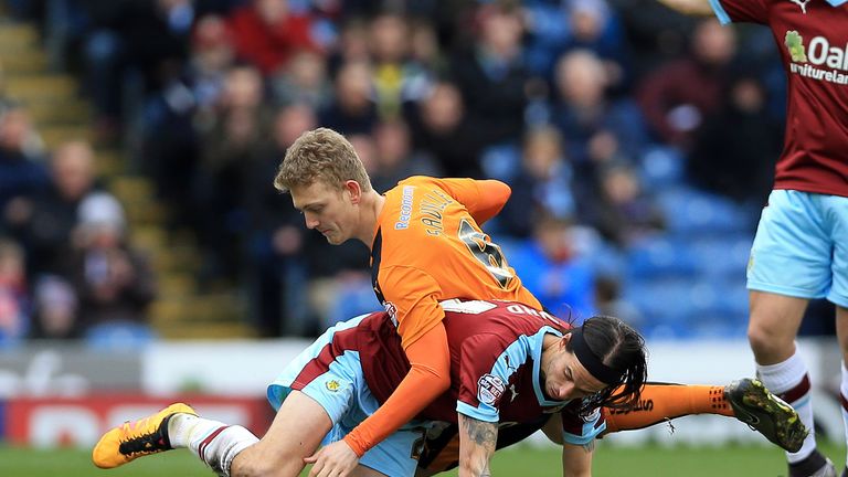 George Boyd and George Saville battle for the ball 