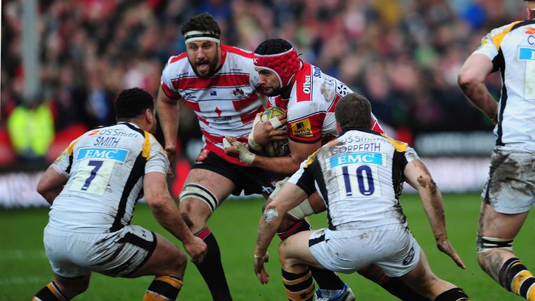 Sione Kalamafoni of Gloucester is tackled by George Smith of Wasps (left) and Jimmy Gopperth of Wasps