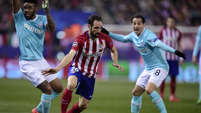 Diego Godin (centre) bursts clear of PSV Eindhoven pair Jurgen Locadia (left) and Andres Guardado