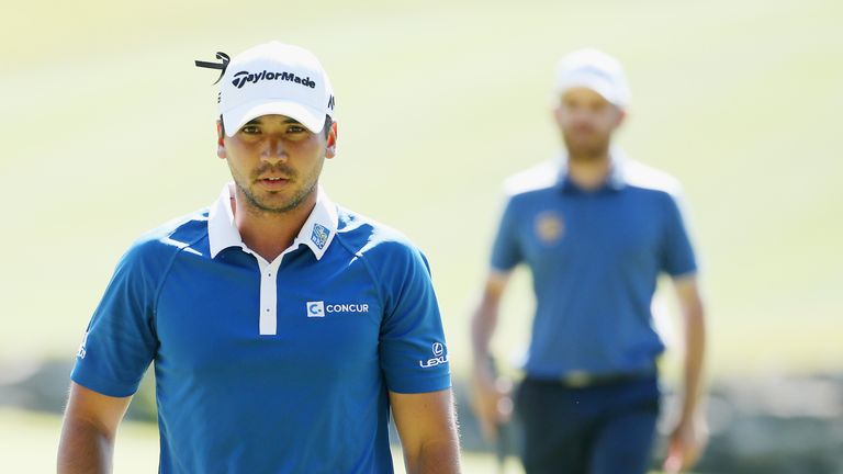 Jason Day strolls off the ninth green after a birdie putt during his match against Louis Oosthuizen