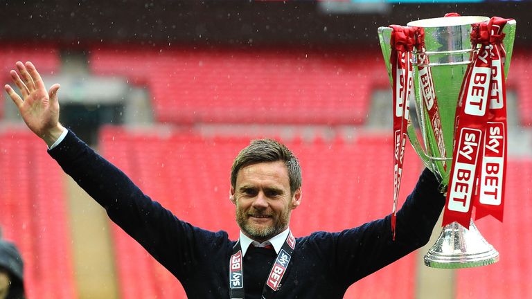 Alexander celebrates victory in the 2014 League Two play-off final