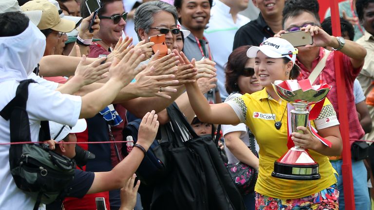 Jang celebrates with the crowd after claiming her second win of the year