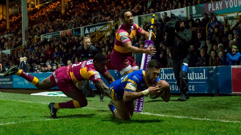 Huddersfield's Jermaine McGillvary couldn't prevent Leeds's Joel Moon from scoring a try