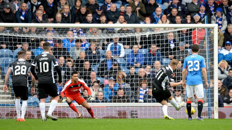 Queen of the South's Iain Russell sends Wes Foderingham the wrong way to equalise against Rangers