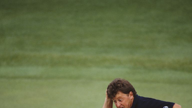 Ian Woosnam of Wales punches the air in triumph as he watches his winning putt on the 18th green during the final round of the US Masters Golf Tournament o