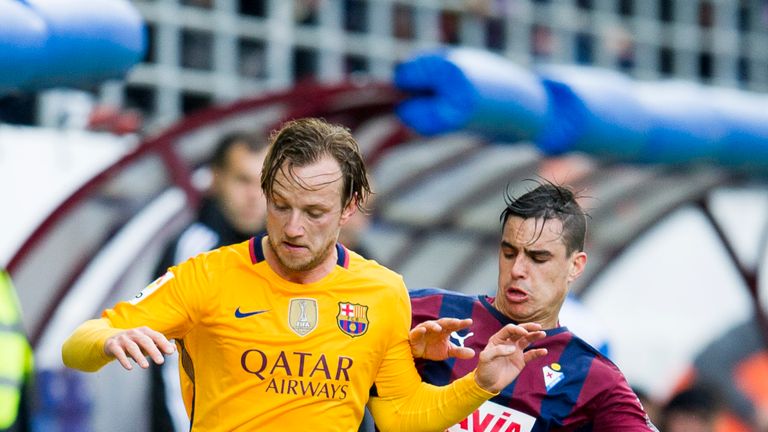 Ivan Rakitic of FC Barcelona duels for the ball with Daniel Garcia of SD Eibar