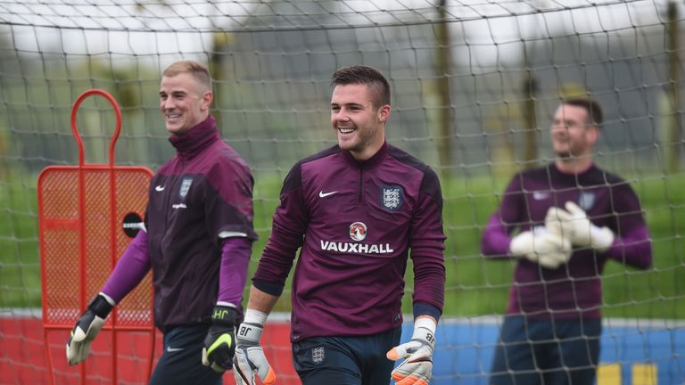 Joe Hart and Jack Butland share a joke during the England training session.