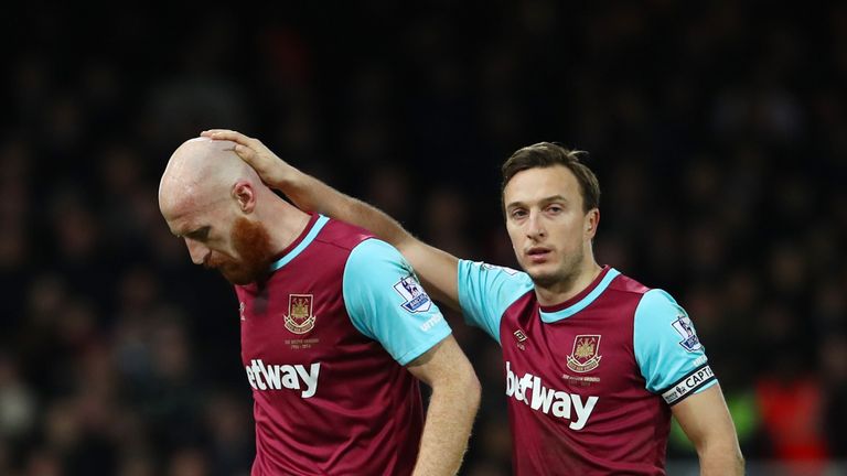 James Collins is consoled by Mark Noble as he goes off injured during West Ham's win over Tottenham