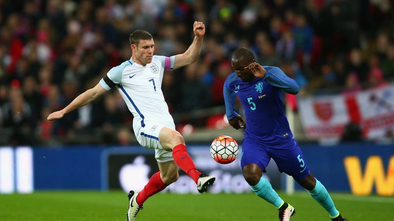 LONDON, ENGLAND - MARCH 29: James Milner of England tackles Jetro Willems of the Netherlands during the International Friendly match between England and Ne