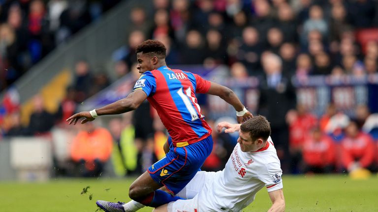 Liverpool's James Milner fouls Crystal Palace's Wilfried Zaha before being sent-off