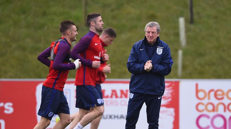 Roy Hodgson of England speaks with Jamie Vardy during England Training Session at St Georges Park on March 22, 2016 in Burton-upon-Trent, England.