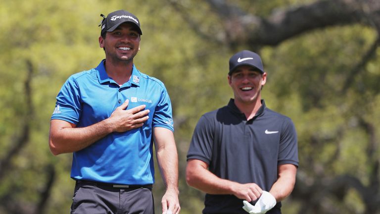 Jason Day and Brooks Koepka share a joke during their quarter-final clash