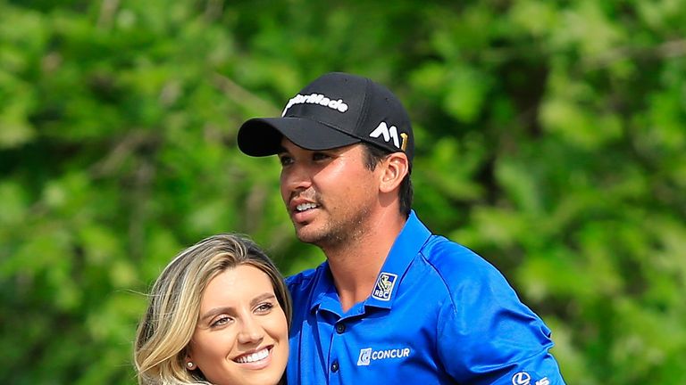 AUSTIN, TX - MARCH 26:  Jason Day of Australia hugs his wife Ellie after winning his match against Brooks Koepka in 