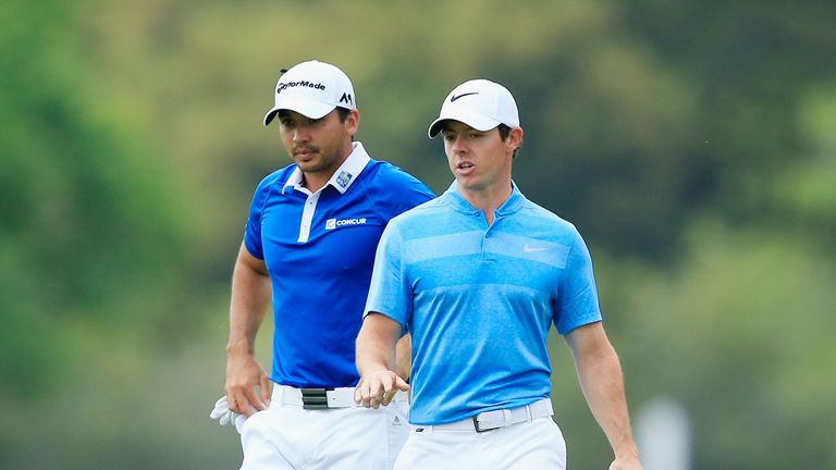 AUSTIN, TX - MARCH 27:  Jason Day of Australia (L) and Rory McIlroy of Northern Ireland walk together up the fifth fairway during their semifinal 
