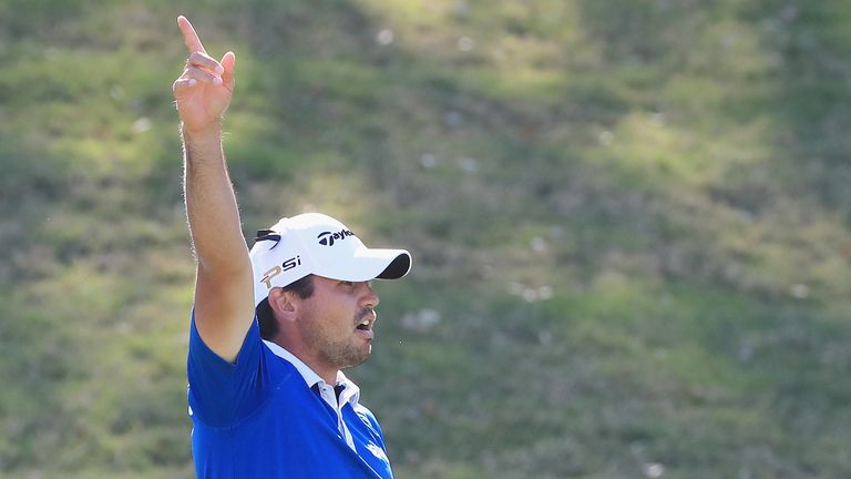 Jason Day of Australia watches a shot on the 12th hole during his match against Louis Oosthuizen of South Africa in the championshi