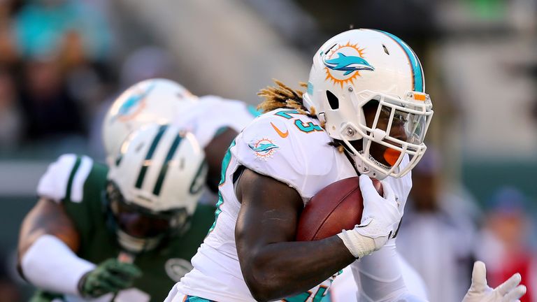 Jay Ajayi #23 of the Miami Dolphins carries the ball in the first half against the New York Jets on November 29, 2015 a