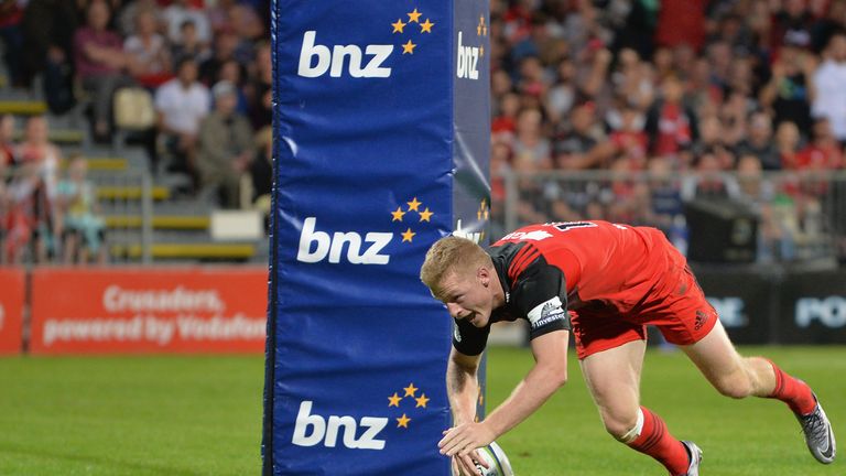 CHRISTCHURCH, NEW ZEALAND - MARCH 19: Johnny McNicholl of the Crusaders dives over to score a try during the round four Super Rugby match between the Crusa