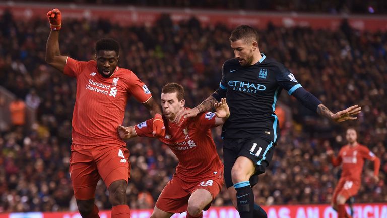 Jon Flanagan is sandwiched between Kolo Toure and Manchester City's Aleksandar Kolarov the Reds' 3-0 victory at Anfield