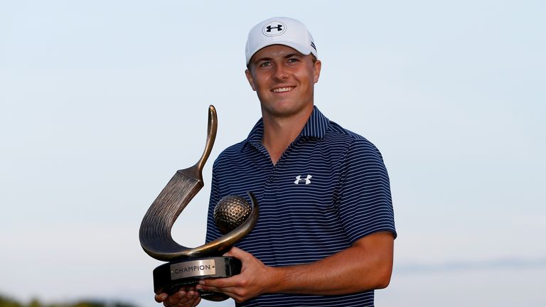 PALM HARBOR, FL - MARCH 15:  Jordan Spieth celebrates with his trophy after winning the Valspar Championship on the third playoff hole during the final rou